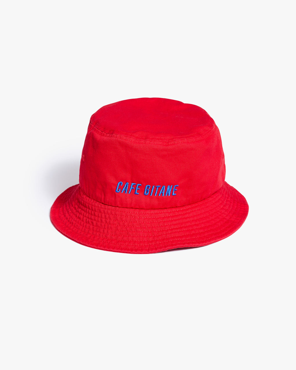 The red Cafe Gitane NYC Bucket Hat is made of 100% Bio-Washed Cotton Chino Twill and embroidered with royal blue thread. The tag and Jimi Hendrix quote is printed inside and the eyelets are sewn to which is more eco-friendly. One Size Fits All.
