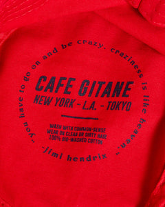 The red Cafe Gitane NYC Bucket Hat is made of 100% Bio-Washed Cotton Chino Twill and embroidered with royal blue thread. The tag and Jimi Hendrix quote is printed inside and the eyelets are sewn to which is more eco-friendly. One Size Fits All.