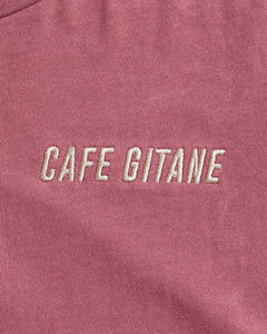 The Cafe Gitane Vintage Wash Embroidered Tee is 100% ring spun cotton. The classic t-shirt in red clay is pigment dyed which means that it has a subtle vintage look and will get more wash the older it gets. It has a printed tag inside shows the care instruction, that it is made in the USA and includes a Jimi Hendrix Quote. It also has the Cafe Gitane logo and stated the cities it has locations in: New York, Los Angeles, and Tokyo. 